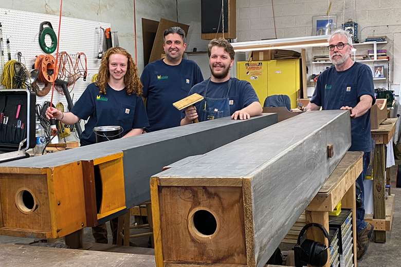 Members of the Buzard team repair Walker pipes from the London City Temple organ, to be installed in St James Cathedral, Chicago